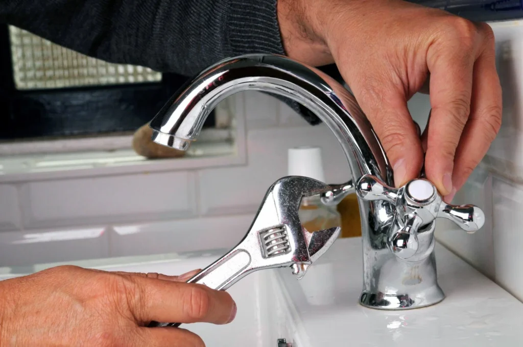 Fixing bathroom faucet, water leak repair